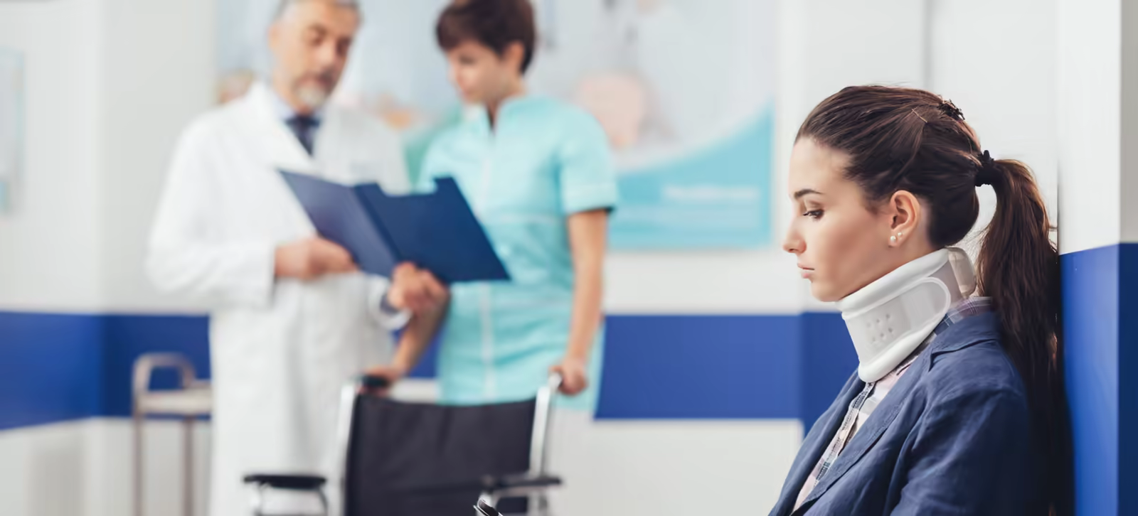 Patient in a neck brace during medical review
