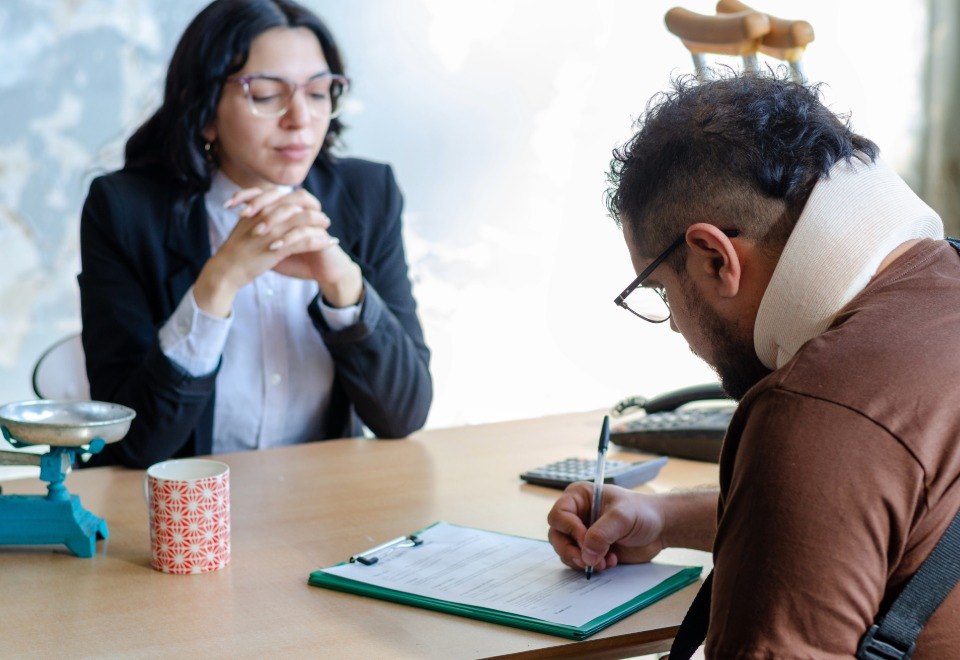 Injured client consulting a lawyer after a drunk driving crash