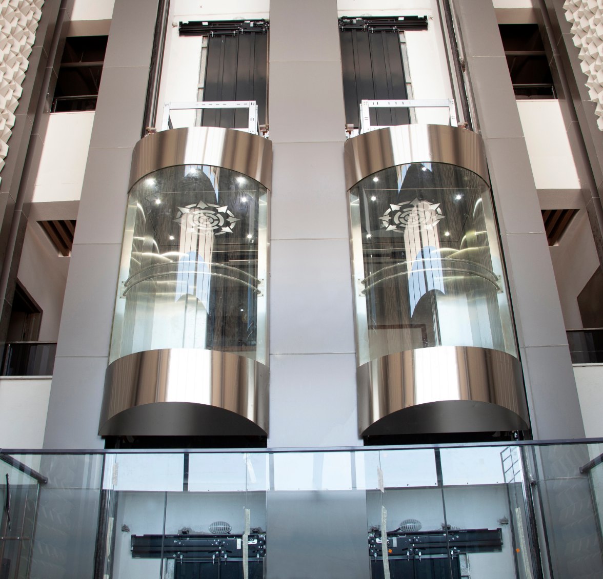 Modern glass elevators in a building lobby
