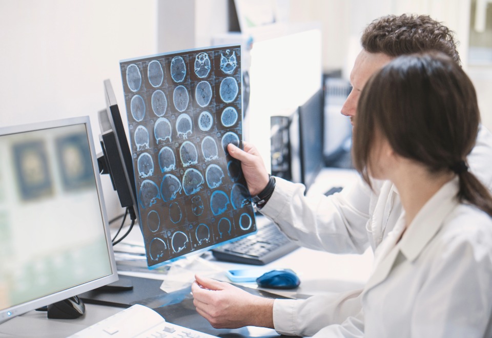 Doctors reviewing brain scan imaging