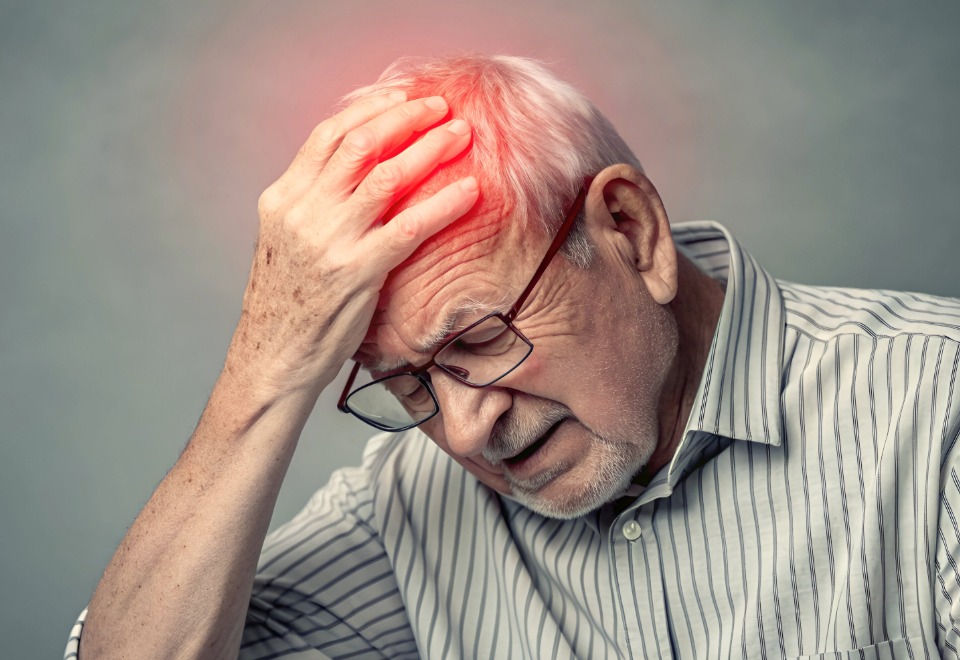 Older adult experiencing head injury pain