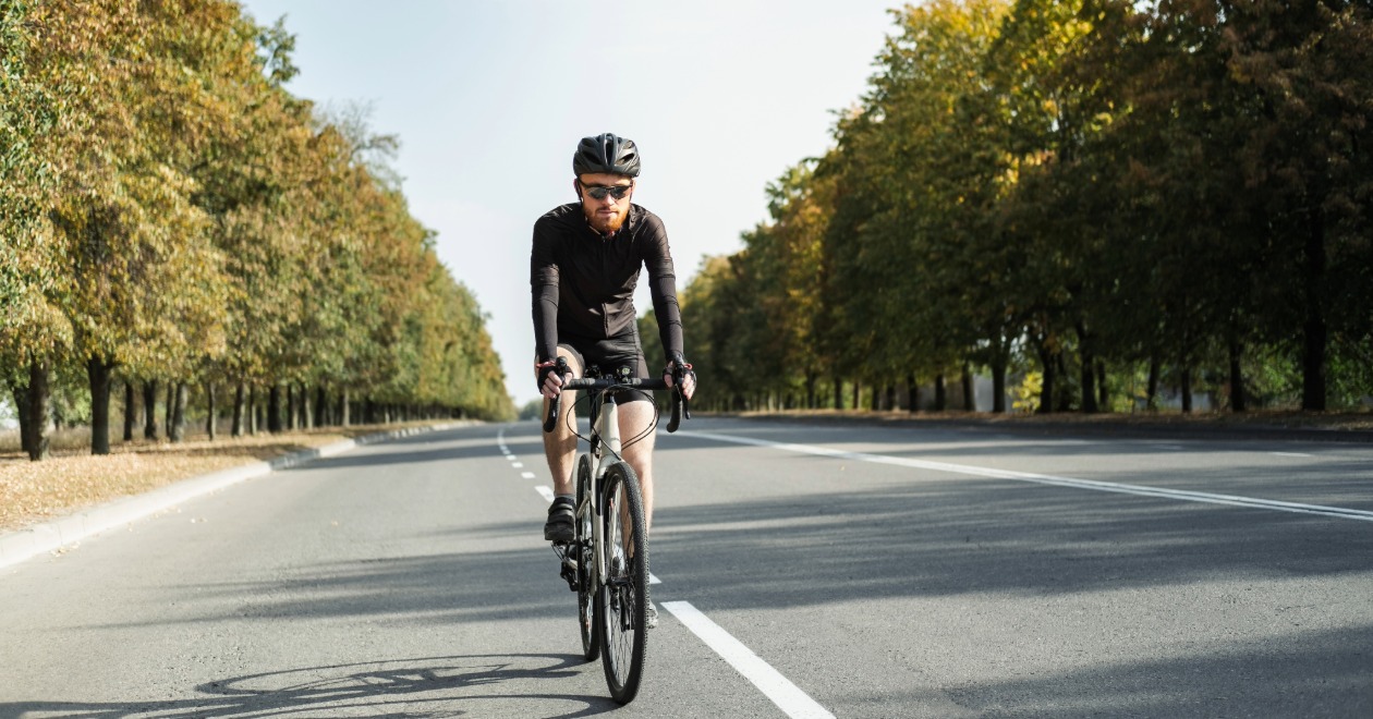 Road cyclist riding on a tree-lined New Jersey street