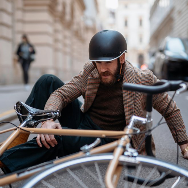 Urban cyclist riding between cars