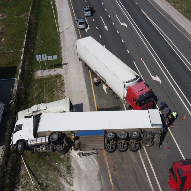 Aerial view of a bus crash blocking highway lanes