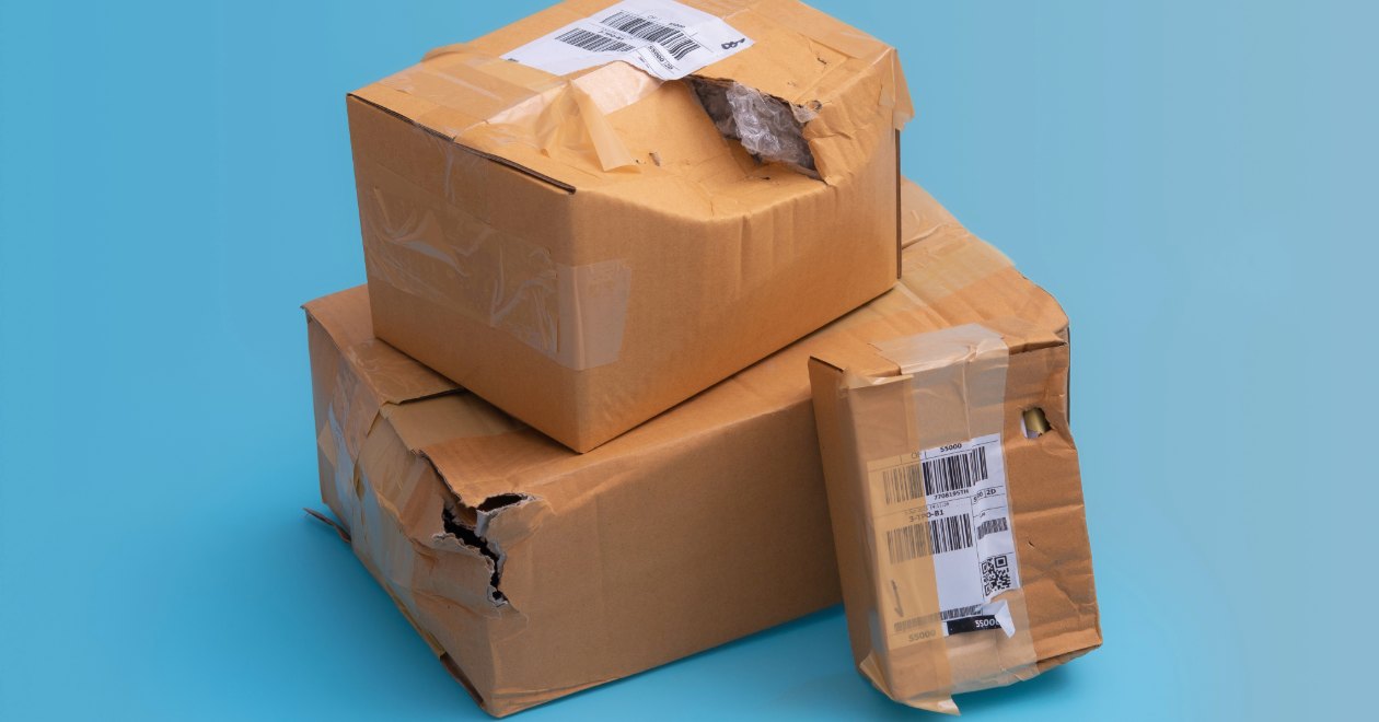 Damaged delivery packages representing delivery accident evidence