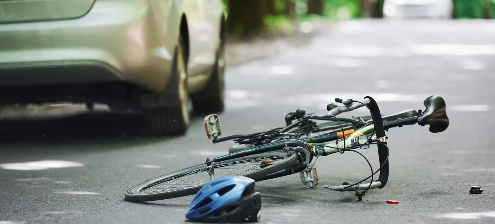 Bicycle and helmet left on the road after a hit-and-run crash