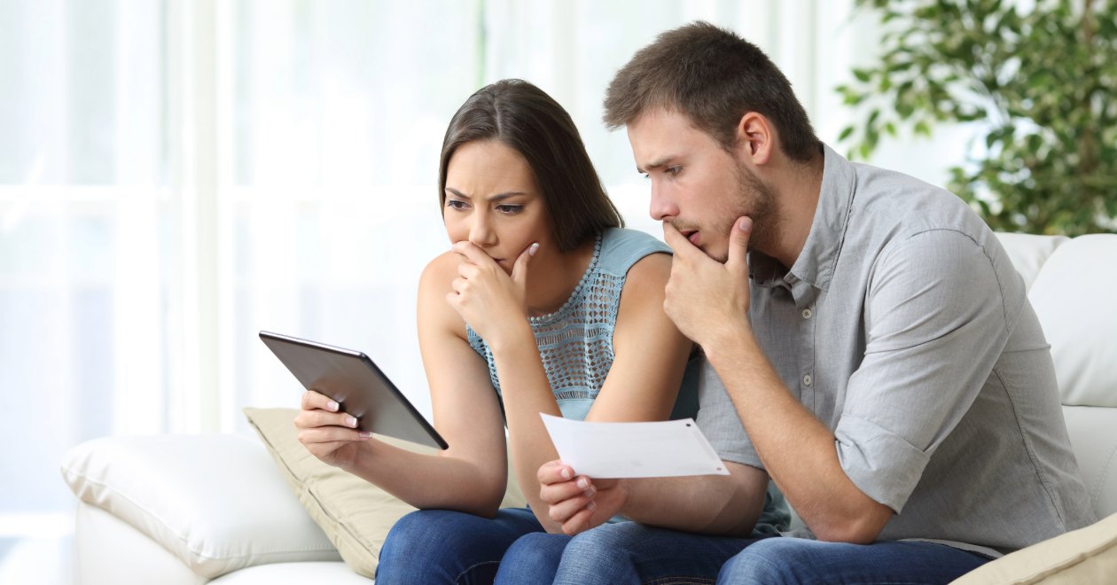Couple reviewing auto insurance documents