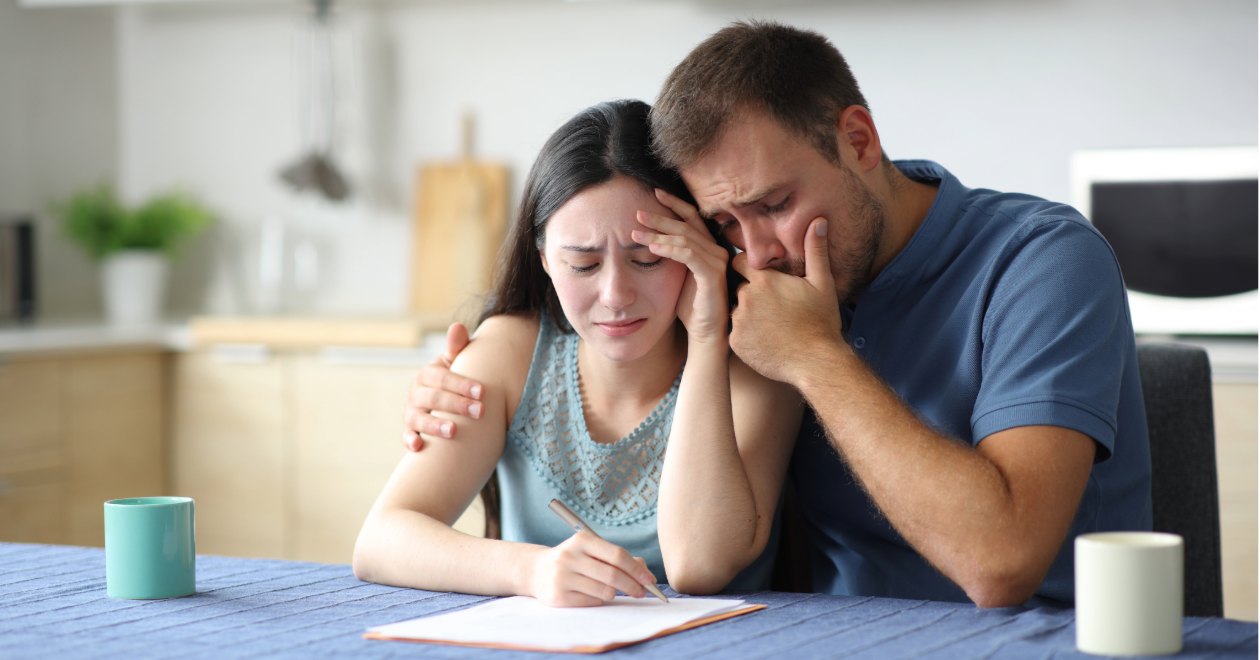 Injured couple reviewing crash-related bills