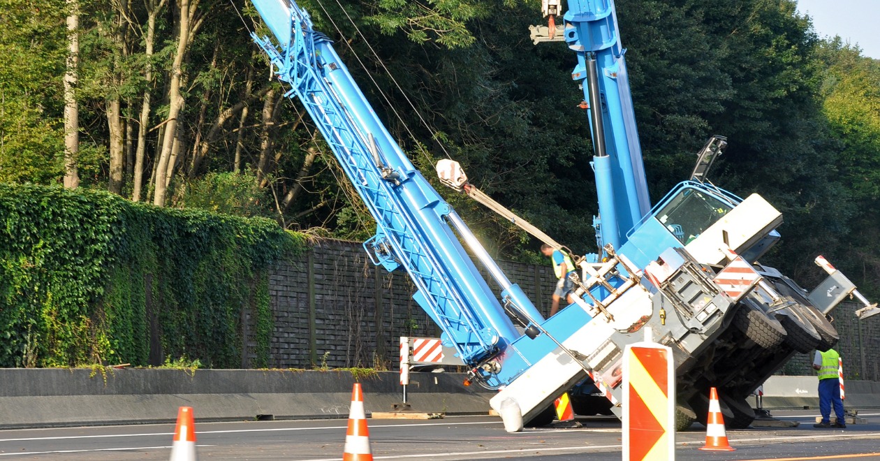 Overturned mobile crane at a construction accident scene