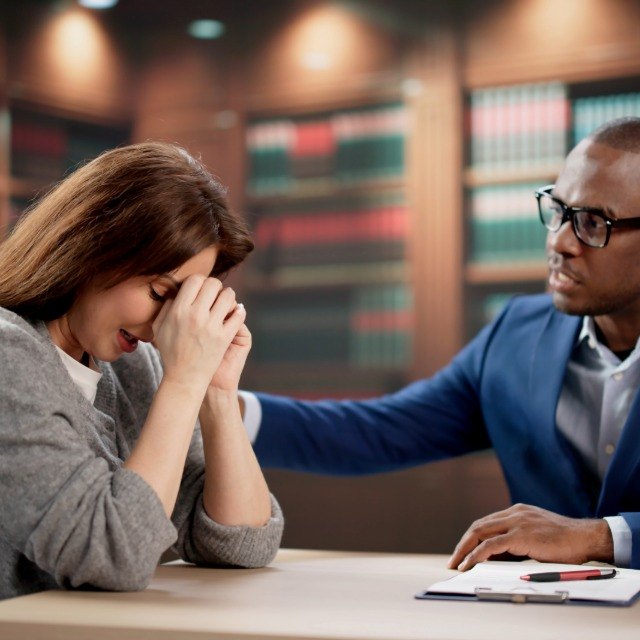 Attorney supporting an injured client during a consultation