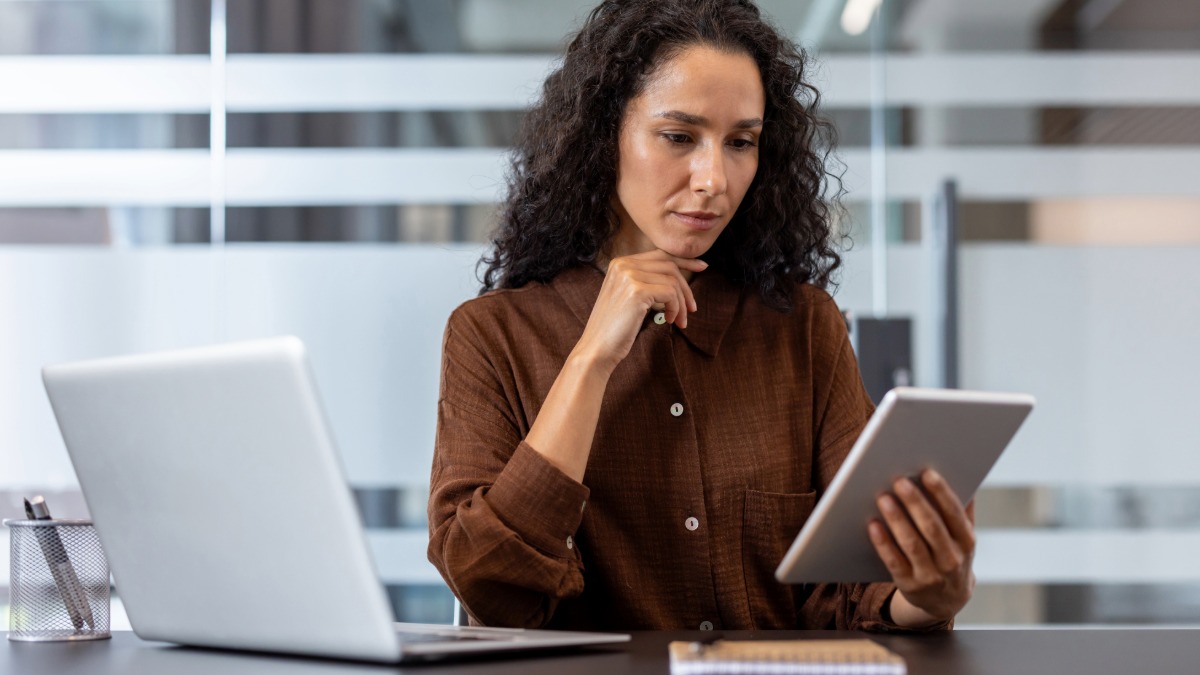 Person checking review source information on a tablet